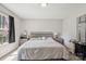This cozy bedroom has carpet, gray walls, and a coordinating gray wood bed frame and side tables at 432 English Ivy Ct, Fort Mill, SC 29715