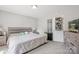 Light-filled bedroom features neutral walls, plush carpet and a bed with a gray wood headboard at 432 English Ivy Ct, Fort Mill, SC 29715