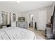 Bedroom with plush carpeting, neutral walls, a dresser, TV, and a gray bed at 432 English Ivy Ct, Fort Mill, SC 29715