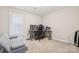 Bedroom with plush carpeting, neutral walls, natural light, a large desk and a couch at 432 English Ivy Ct, Fort Mill, SC 29715