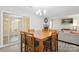 Open-concept dining room with fireplace view, sliding glass door and living room access at 432 English Ivy Ct, Fort Mill, SC 29715