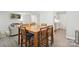 Open concept living and dining area with view to kitchen and comfortable seating at 432 English Ivy Ct, Fort Mill, SC 29715