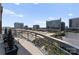 Curved balcony offering panoramic cityscape views, complete with outdoor seating at 435 S Tryon St # 907, Charlotte, NC 28202