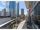 Extended balcony with seating, offering breathtaking views of the city's skyscrapers at 435 S Tryon St # 907, Charlotte, NC 28202