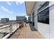 Spacious condo balcony featuring sleek railings, outdoor seating, grill, and city views at 435 S Tryon St # 907, Charlotte, NC 28202