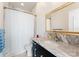 Elegant bathroom with marble countertops and shower at 435 S Tryon St # 907, Charlotte, NC 28202