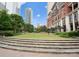 Beautiful community park surrounded by skyscrapers and lush greenery at 435 S Tryon St # 907, Charlotte, NC 28202