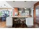Well-appointed kitchen with a center island with seating and stainless steel appliances, perfect for cooking at 435 S Tryon St # 907, Charlotte, NC 28202