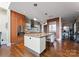 Contemporary kitchen with stainless steel appliances, a center island with seating, and modern finishes at 435 S Tryon St # 907, Charlotte, NC 28202