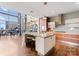 Modern kitchen featuring sleek cabinets, granite countertops, stainless steel appliances and a large island at 435 S Tryon St # 907, Charlotte, NC 28202