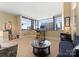 Bright living room area featuring city views, neutral color palette, and a designated work space at 435 S Tryon St # 907, Charlotte, NC 28202