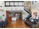 Open-concept living space with modern kitchen and staircase at 435 S Tryon St # 907, Charlotte, NC 28202