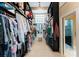 Spacious walk-in closet with ample storage space, custom shelving, and natural light at 435 S Tryon St # 907, Charlotte, NC 28202