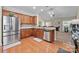 Spacious kitchen features hardwood floors, stainless steel appliances, and granite countertops at 4527 Hubbard Falls Dr, Charlotte, NC 28269