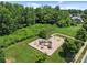 A well-equipped playground is nestled among mature trees and expansive green space at 4527 Hubbard Falls Dr, Charlotte, NC 28269