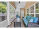 Sunroom features brick flooring, light neutral walls and comfortable seating at 4527 Hubbard Falls Dr, Charlotte, NC 28269