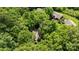 Aerial view of home nestled among lush trees, showcasing its peaceful setting at 498 Glory Ct, Fort Mill, SC 29715
