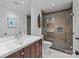 Bathroom featuring modern vanity, toilet, and glass-enclosed shower with tile surround and recessed niche at 498 Glory Ct, Fort Mill, SC 29715