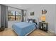 Bright bedroom featuring hardwood floors, a cozy bed, and a window for a comfortable retreat at 498 Glory Ct, Fort Mill, SC 29715