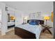 Bright bedroom featuring hardwood floors, a cozy bed, and stylish side tables for a comfortable retreat at 498 Glory Ct, Fort Mill, SC 29715