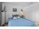 Well-lit bedroom features hardwood floors, a comfortable bed, and a closet for ample storage space at 498 Glory Ct, Fort Mill, SC 29715