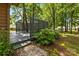 This outdoor deck offers a cozy space, privacy screening, and surrounding trees at 498 Glory Ct, Fort Mill, SC 29715