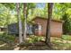 Back of the home with a wooden deck, privacy screening, and wooded surroundings at 498 Glory Ct, Fort Mill, SC 29715