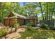 Charming single-story home featuring mature landscaping, a brick facade, and a cozy front porch at 498 Glory Ct, Fort Mill, SC 29715