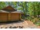 Spacious two-car garage of home with a brick facade, complemented by a driveway and lush greenery at 498 Glory Ct, Fort Mill, SC 29715