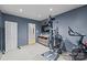 Well-lit home gym featuring exercise equipment, a mounted TV, and calming gray walls for a focused workout at 498 Glory Ct, Fort Mill, SC 29715