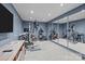 Home gym boasts mirrored walls, neutral carpet, and a variety of exercise equipment for a complete workout at 498 Glory Ct, Fort Mill, SC 29715
