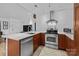Updated kitchen with stainless steel appliances, white countertops, and ample counter space at 498 Glory Ct, Fort Mill, SC 29715