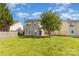 Backyard with grass and trees, including the back of the home at 5307 Ayers Orchard Way, Charlotte, NC 28227