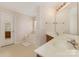 Bathroom featuring dual sinks, vanity, and separate bathtub at 5307 Ayers Orchard Way, Charlotte, NC 28227