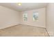 Neutral bedroom with carpet and two windows at 5307 Ayers Orchard Way, Charlotte, NC 28227