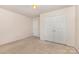 Neutral bedroom with a double doored closet at 5307 Ayers Orchard Way, Charlotte, NC 28227