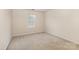 Well-lit carpeted bedroom featuring a single window with natural light at 5307 Ayers Orchard Way, Charlotte, NC 28227