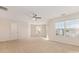 Spacious bedroom with neutral carpet, ceiling fan, and natural light from multiple windows at 5307 Ayers Orchard Way, Charlotte, NC 28227