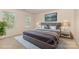 Staged bedroom featuring plush carpeting, stylish decor, and abundant natural light, creating a cozy atmosphere at 5307 Ayers Orchard Way, Charlotte, NC 28227