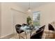 Staged dining area with a glass table, six chairs, and sliding door at 5307 Ayers Orchard Way, Charlotte, NC 28227