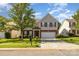 Charming two-story home with brick accents, a well-manicured lawn, and a two-car garage at 5307 Ayers Orchard Way, Charlotte, NC 28227