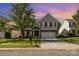 Charming two-story home with brick accents, a well-manicured lawn, and a two-car garage at 5307 Ayers Orchard Way, Charlotte, NC 28227