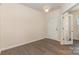 Hallway with doorway and light brown wood flooring at 5307 Ayers Orchard Way, Charlotte, NC 28227