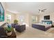 Staged main bedroom with furniture, television and natural lighting at 5307 Ayers Orchard Way, Charlotte, NC 28227