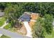 Aerial view showcasing a home with a long driveway, well-manicured landscaping, and mature trees at 6425 Pamela St, Huntersville, NC 28078