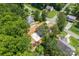 Aerial view of a property with a spacious backyard, mature trees, and a serene neighborhood setting at 6425 Pamela St, Huntersville, NC 28078