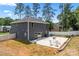 Two-story home with a spacious backyard, a concrete patio, and lush landscaping for outdoor enjoyment at 6425 Pamela St, Huntersville, NC 28078