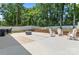Expansive backyard with a concrete patio, a grill, and ample seating for outdoor entertaining at 6425 Pamela St, Huntersville, NC 28078