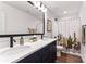 Bathroom features a double sink vanity, modern fixtures, and a stylish mirror at 6425 Pamela St, Huntersville, NC 28078