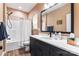 Well-appointed bathroom features a modern vanity, shower with curtain, and neutral color palette at 6425 Pamela St, Huntersville, NC 28078